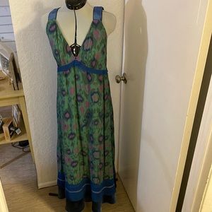 Low v neck empire waist printed maxi dress with velvet trim.